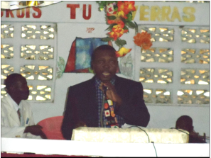 Pastor Moise preaching
